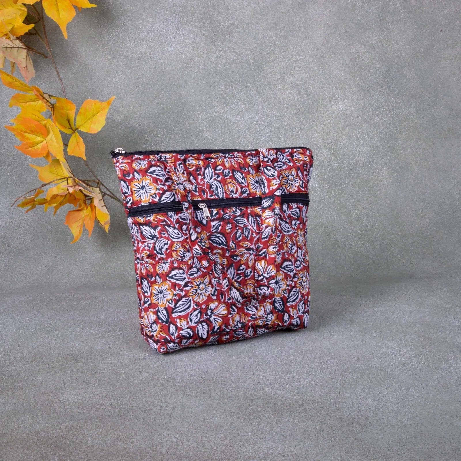 Small Handbag Maroon Colour with Blue Leaf Design.