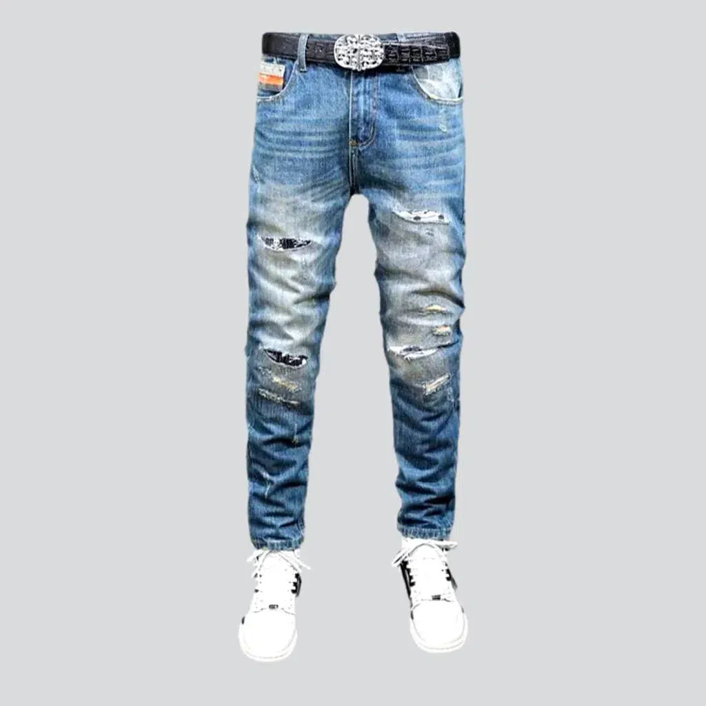 Small skulls embroidery jeans
 for men