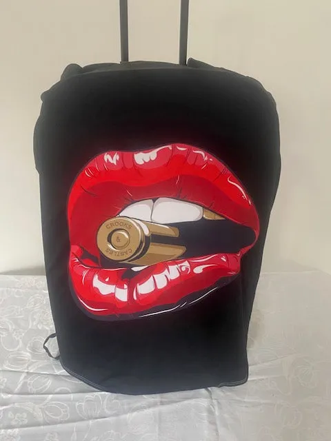 Suitcase cover, red lipstick with a bullet.