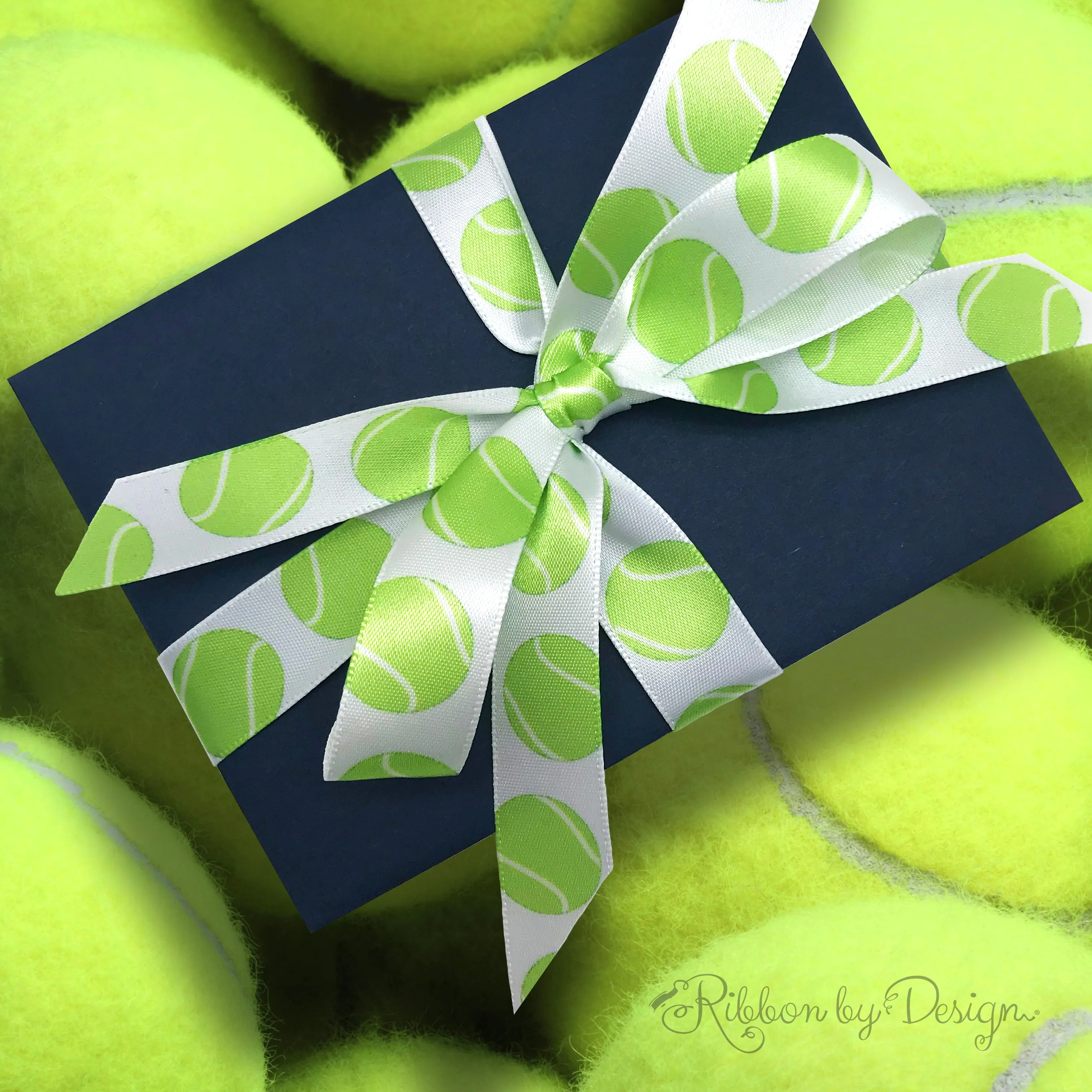 Tennis Ribbon green tennis balls bounce along on a white background printed on 5/8" single face satin