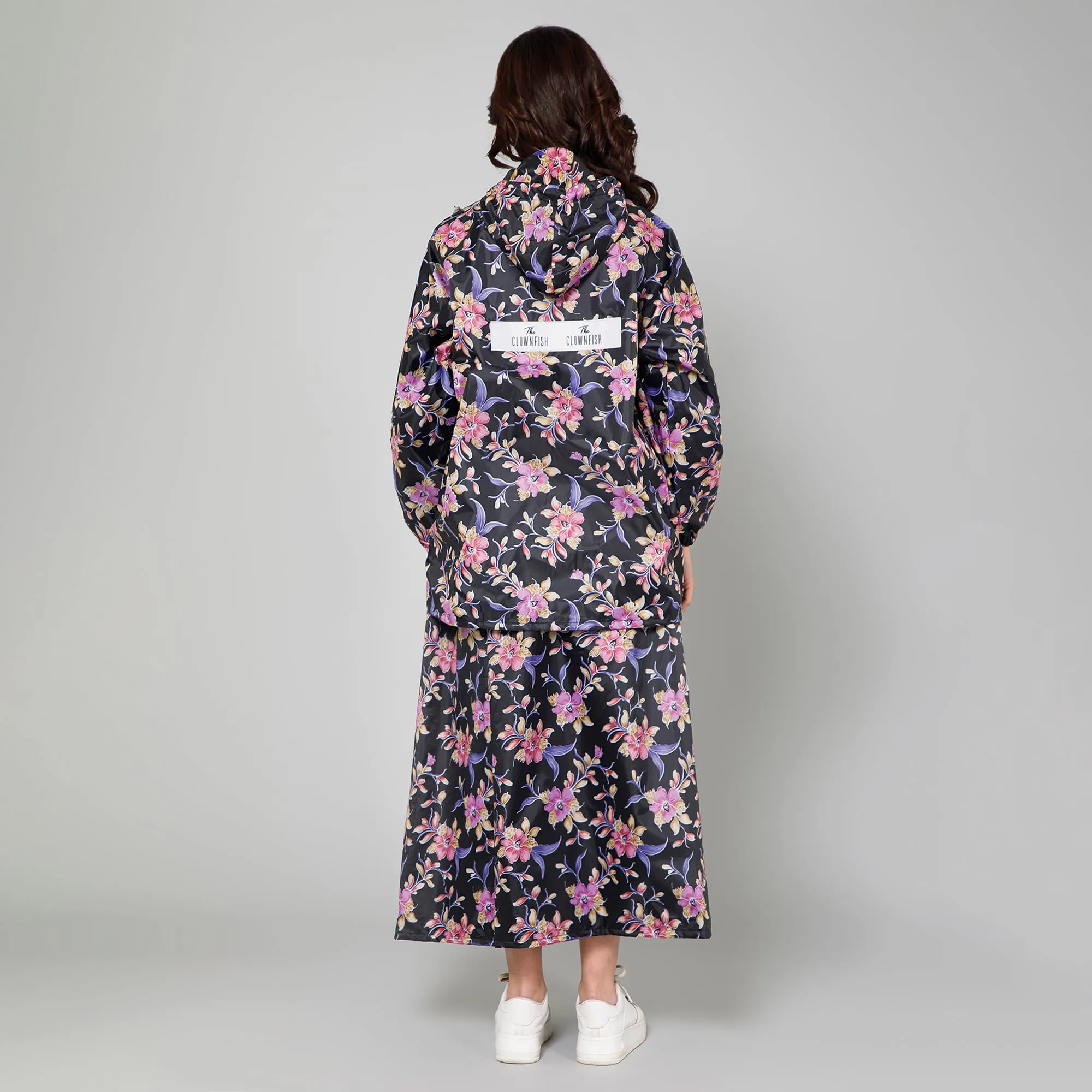 THE CLOWNFISH Polyester Waterproof Rain Coat For Women Skirt and Top Raincoat With Adjustable Hood and Front Pockets Rain Glam Series (Black Floral, XX-Large)