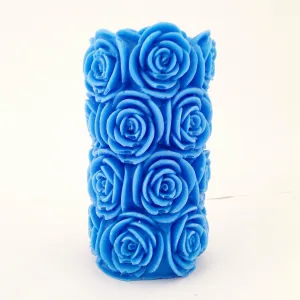 The Decor Affair 1 Pcs Aroma of Royal Azure Serenity Embrace Your Space, as The Intricately Designed Blue Rose Pillar Scented Candle Whispers Tales of Floral Fantasy, Creating a Relaxing Atmosphere.