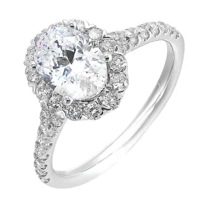 This breathtaking engagement ring combines classic and modern styles with a dazzling oval center and halo followed by a tapered shank look.