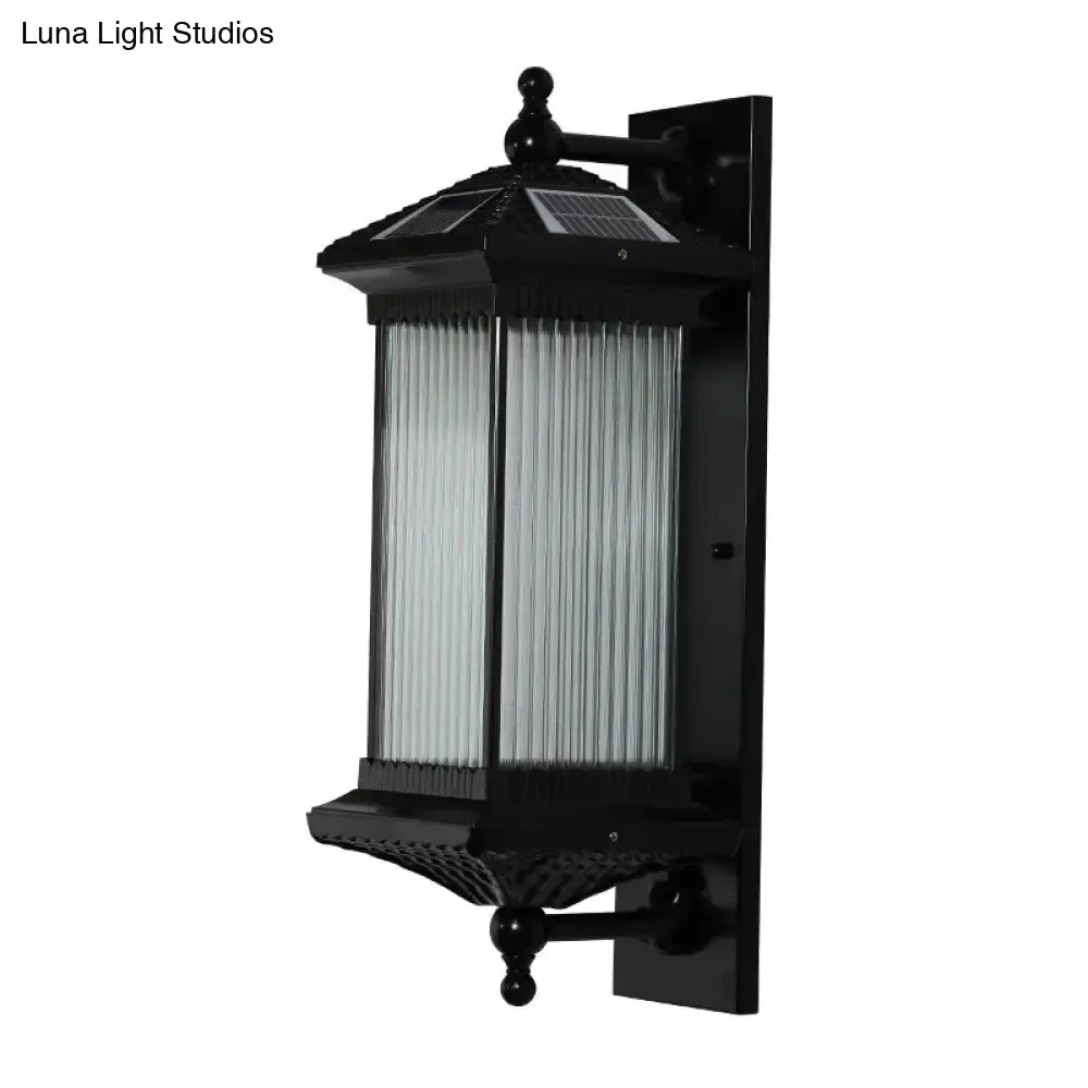 Traditional Glass LED Outdoor Wall Light with Solar Power and Ribbed Design.