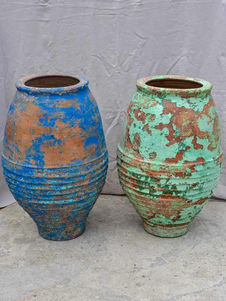 Two very large antique Spanish olive oil jars - blue and green