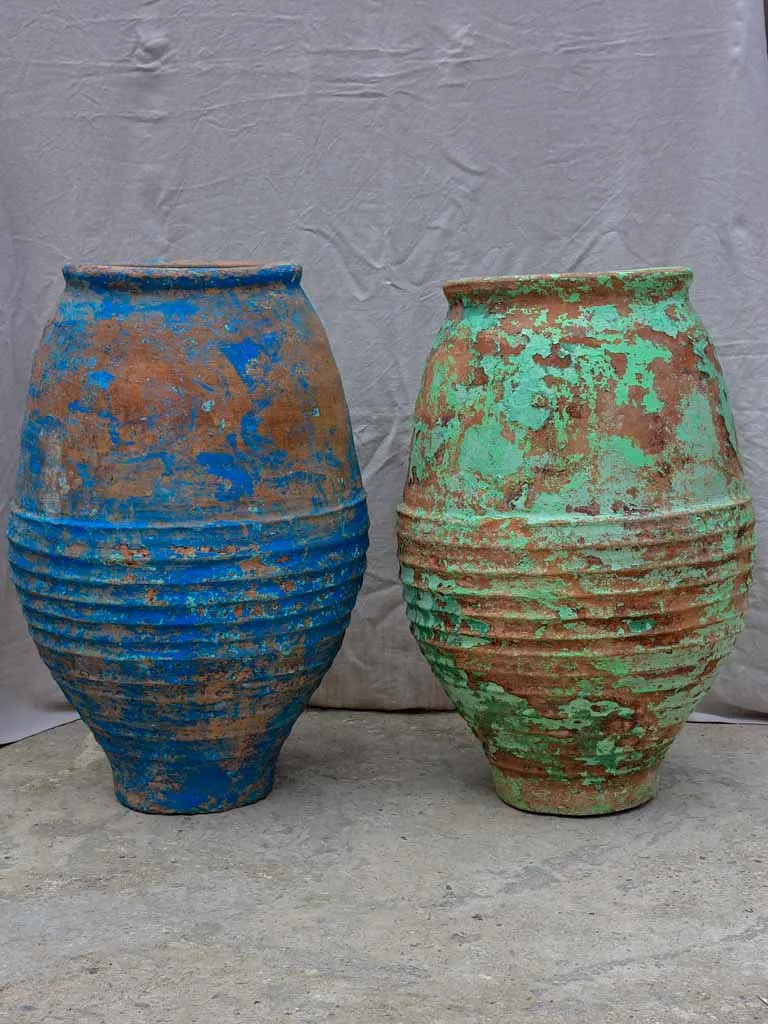 Two very large antique Spanish olive oil jars - blue and green