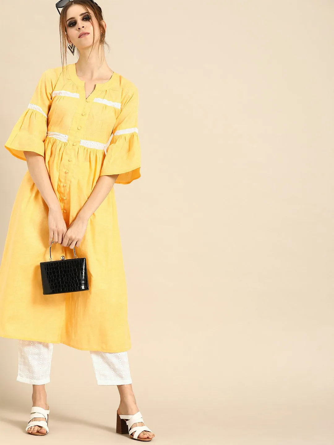 Women Pastel Yellow Three-Quarter Sleeves Solid Flared Pure Cotton Kurta With Schiffli Trouser