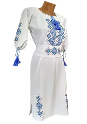 Women's embroidered dress in white color with a geometric ornament