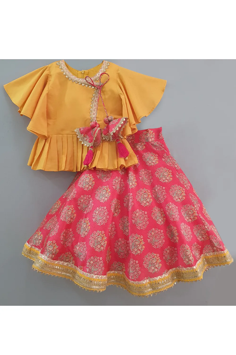 Yellow angrakha style top and red floral lehenga