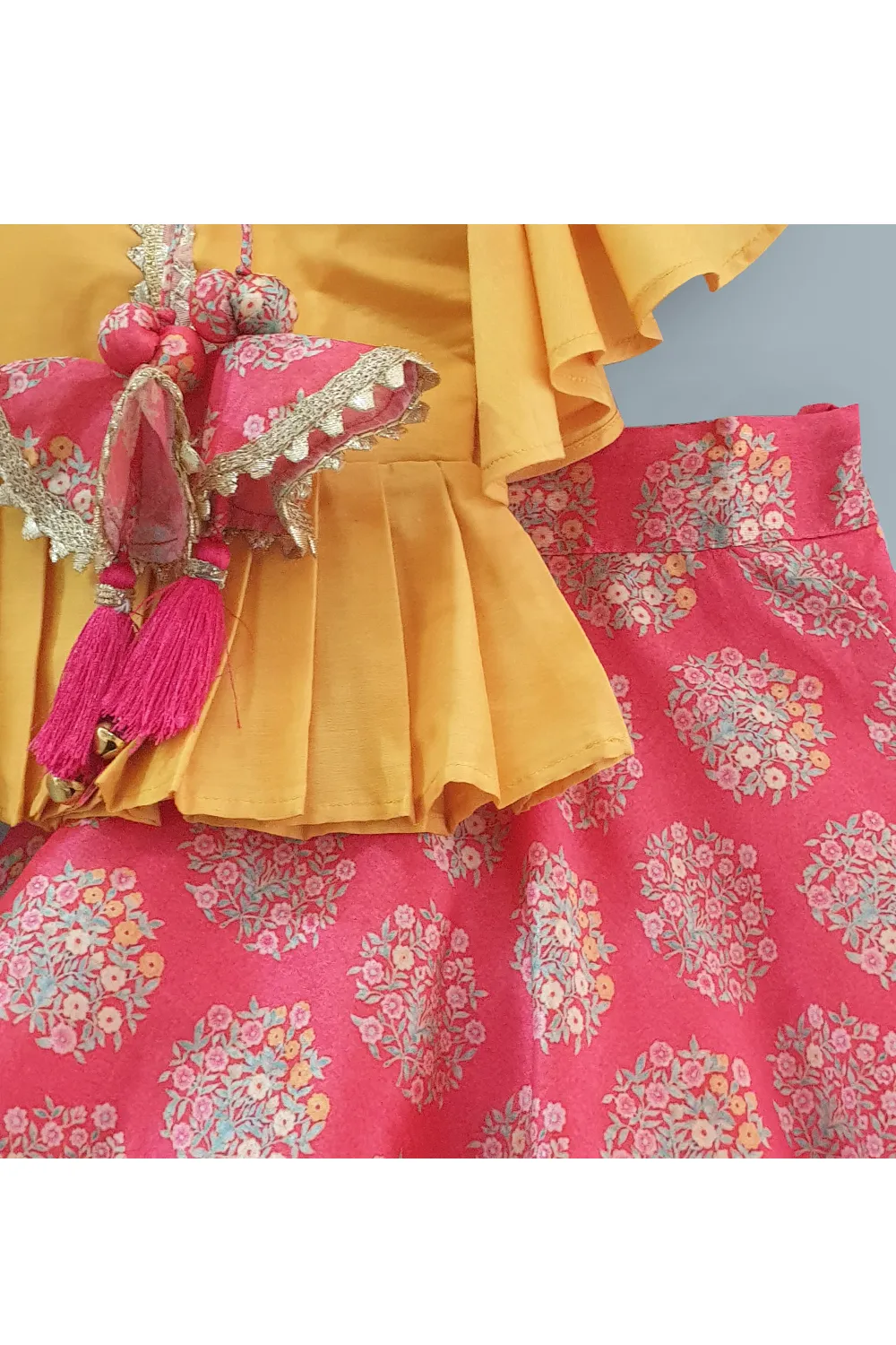 Yellow angrakha style top and red floral lehenga