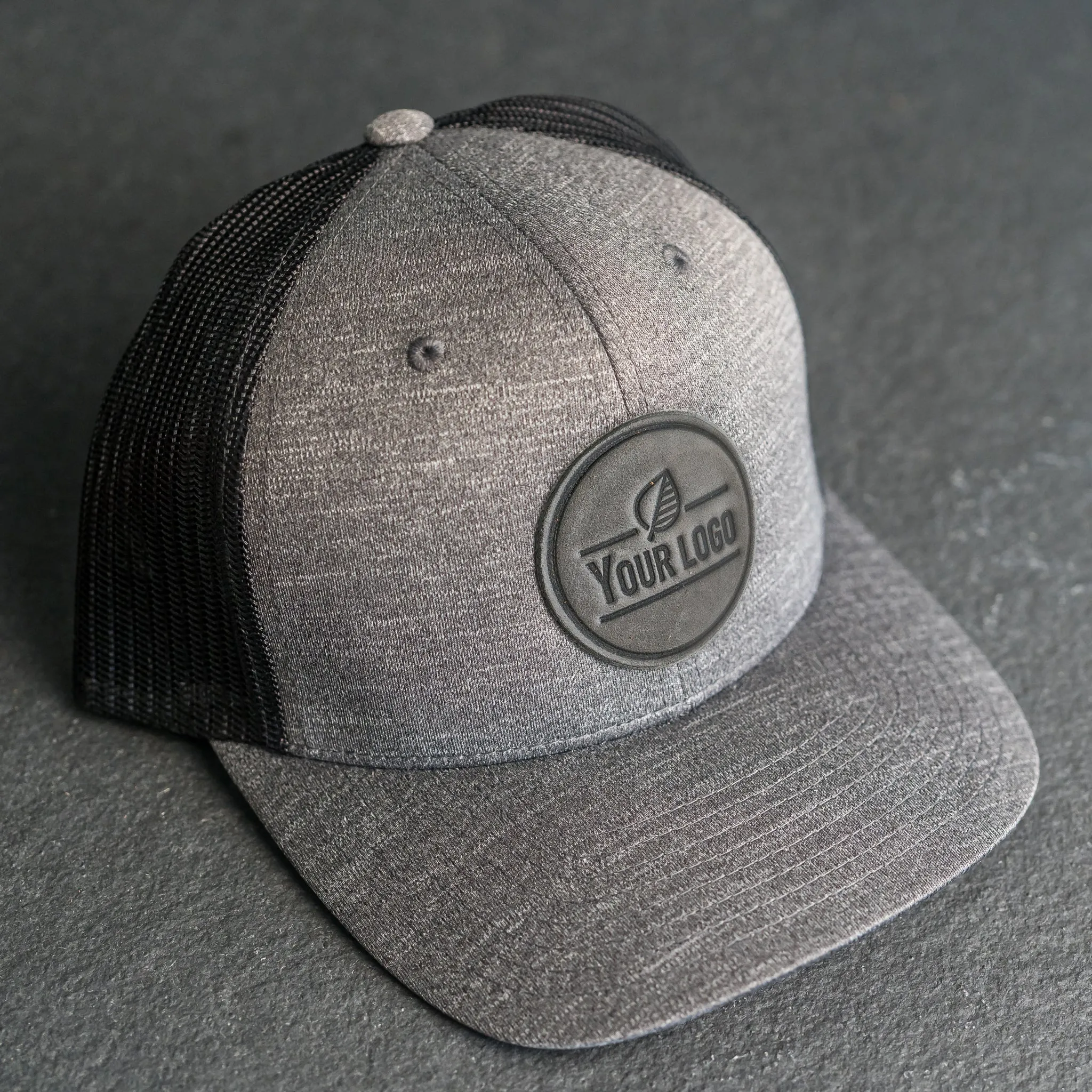 Your Logo on a Leather Patch Performance Style Trucker Hat - Circle Patch